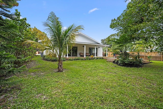 1567 NE Sottong Ave, Jensen Beach, FL 34957 - rear view of property with a deck