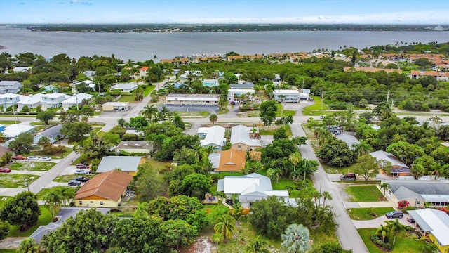 1567 NE Sottong Ave, Jensen Beach, FL 34957 - aerial perspective of suburban area with a nearby body of water