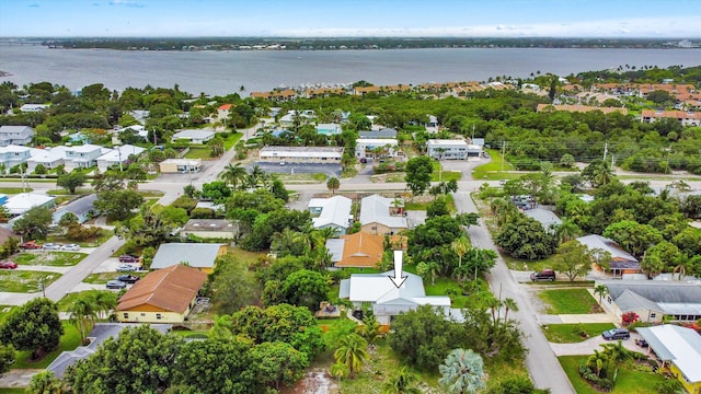 1567 NE Sottong Ave, Jensen Beach, FL 34957 - aerial perspective of suburban area featuring a nearby body of water
