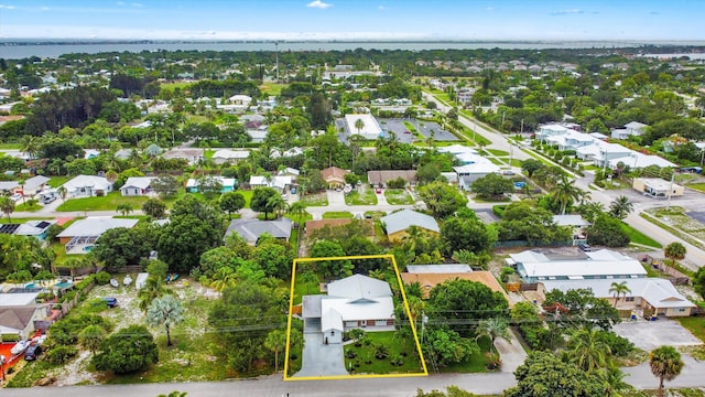 1567 NE Sottong Ave, Jensen Beach, FL 34957 - aerial view of residential area with property parcel outlined