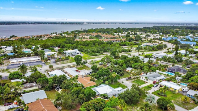 1567 NE Sottong Ave, Jensen Beach, FL 34957 - aerial overview of property's location with nearby suburban area and a large body of water