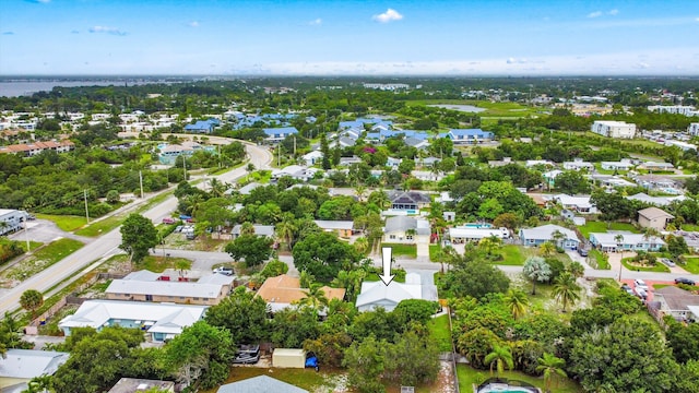 1567 NE Sottong Ave, Jensen Beach, FL 34957 - aerial view of property and surrounding area with nearby suburban area