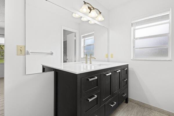 1830 Well Rd, Fort Pierce, FL 34945 - bathroom with vanity, healthy amount of natural light, and baseboards