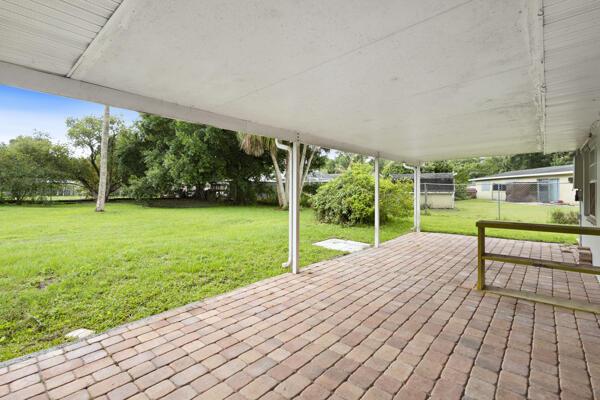 1830 Well Rd, Fort Pierce, FL 34945 - deck with a lawn