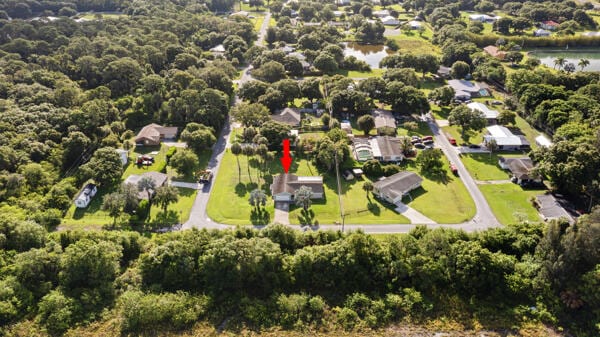 1830 Well Rd, Fort Pierce, FL 34945 - aerial overview of property's location with a forest