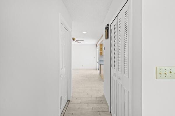 1830 Well Rd, Fort Pierce, FL 34945 - hallway with recessed lighting, wood finish floors, and baseboards