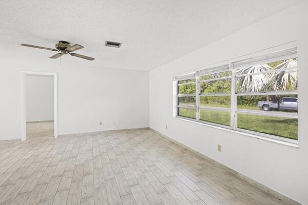 1830 Well Rd, Fort Pierce, FL 34945 - unfurnished room with light wood-style floors and ceiling fan