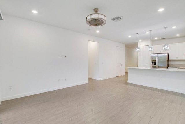 14556 Wiley Range Rd, Delray Beach, FL 33446 - unfurnished living room featuring recessed lighting and light wood-type flooring