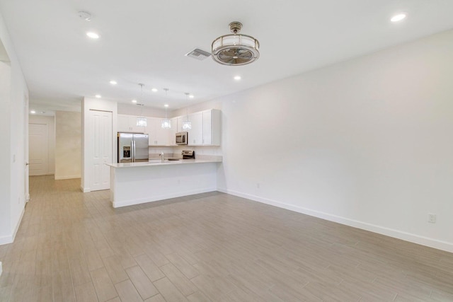 14556 Wiley Range Rd, Delray Beach, FL 33446 - unfurnished living room featuring light wood finished floors and recessed lighting