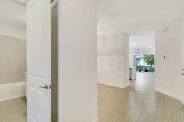 14556 Wiley Range Rd, Delray Beach, FL 33446 - corridor with light wood finished floors and baseboards
