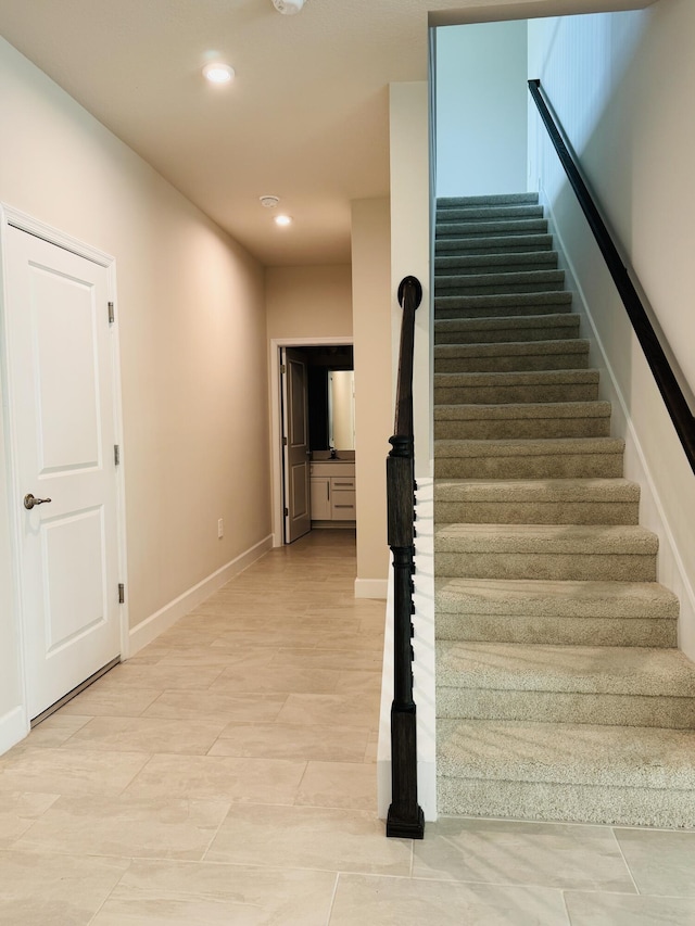 163 SW Pomeroy St, Stuart, FL 34997 - staircase with recessed lighting and baseboards