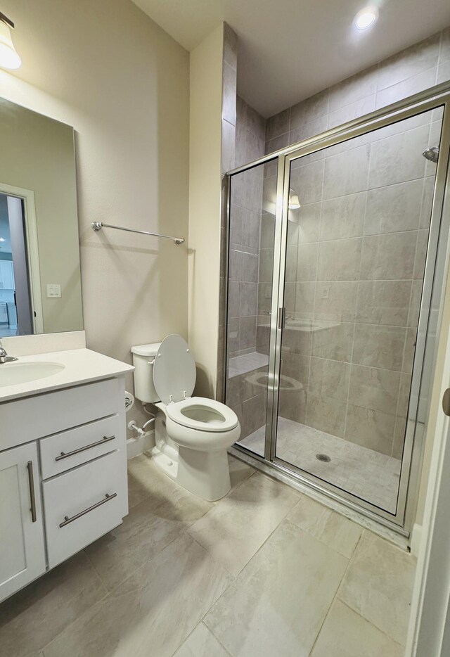 163 SW Pomeroy St, Stuart, FL 34997 - full bathroom featuring toilet, vanity, a stall shower, and recessed lighting