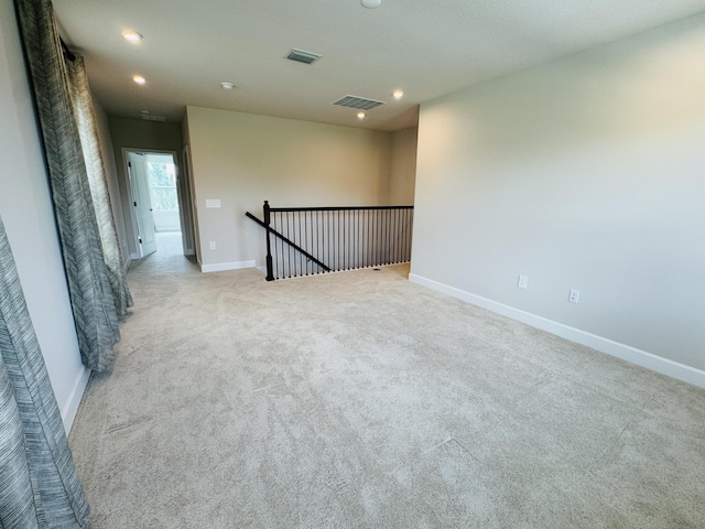 163 SW Pomeroy St, Stuart, FL 34997 - unfurnished room with carpet, baseboards, and recessed lighting