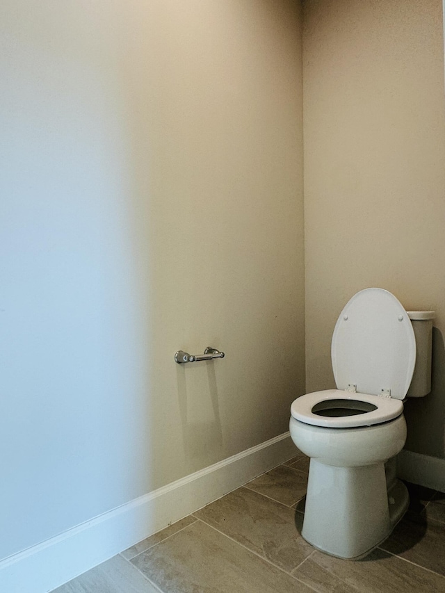 163 SW Pomeroy St, Stuart, FL 34997 - bathroom featuring toilet and baseboards