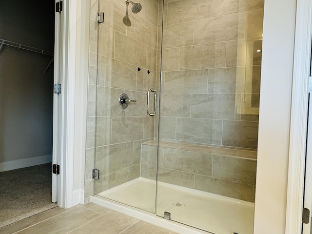 163 SW Pomeroy St, Stuart, FL 34997 - bathroom featuring a shower stall and a walk in closet