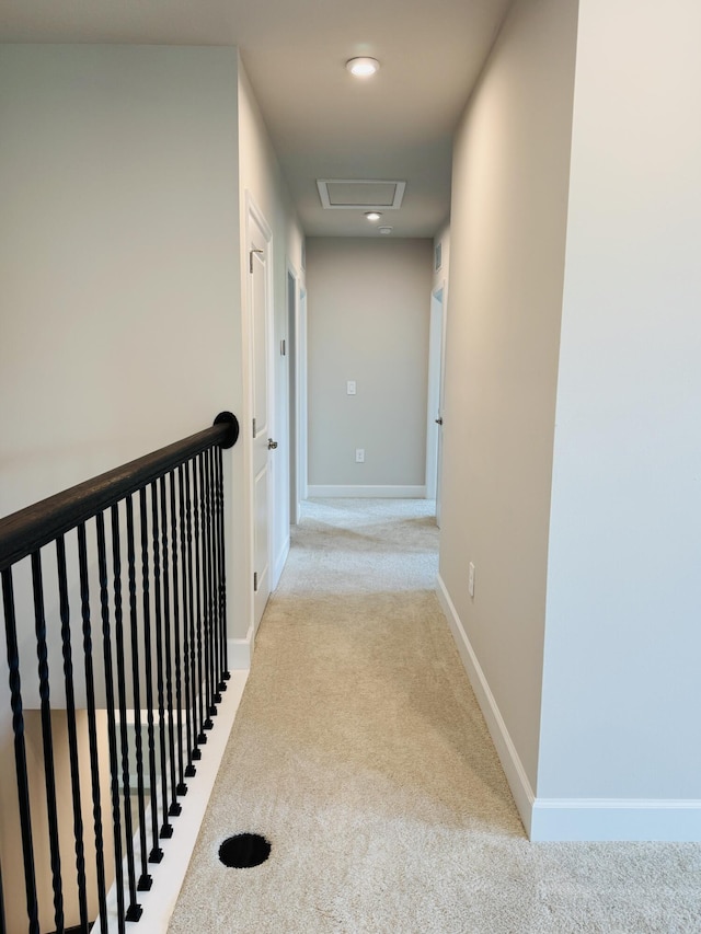163 SW Pomeroy St, Stuart, FL 34997 - hallway featuring carpet flooring, baseboards, recessed lighting, and an upstairs landing