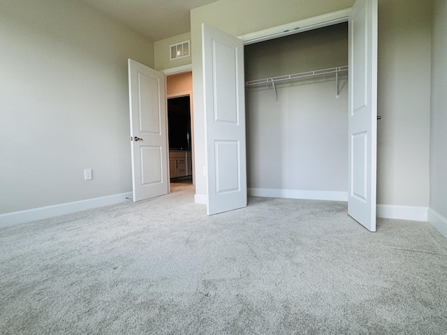 163 SW Pomeroy St, Stuart, FL 34997 - unfurnished bedroom with carpet floors, a closet, and baseboards