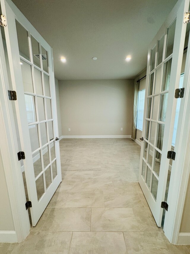 163 SW Pomeroy St, Stuart, FL 34997 - unfurnished room with french doors, recessed lighting, and baseboards