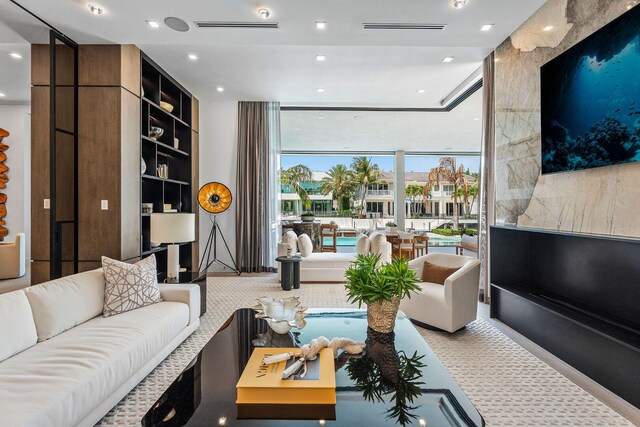 207 W Coconut Palm Rd, Boca Raton, FL 33432 - carpeted living area featuring floor to ceiling windows and recessed lighting