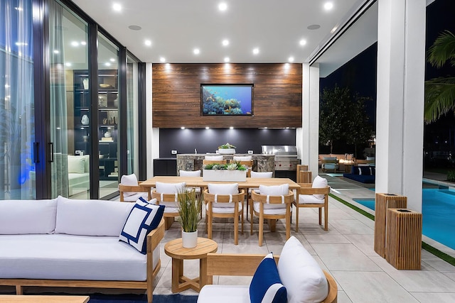 207 W Coconut Palm Rd, Boca Raton, FL 33432 - view of patio featuring an outdoor hangout area, exterior kitchen, outdoor dining area, an outdoor pool, and french doors