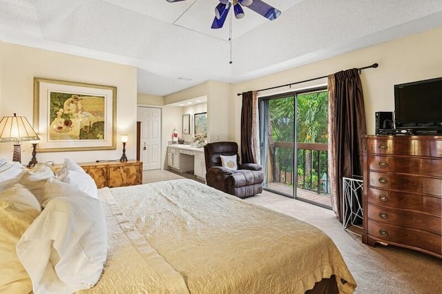 7 Atrium Cir Unit D, Atlantis, FL 33462 - bedroom featuring light carpet, access to exterior, connected bathroom, ceiling fan, and a raised ceiling