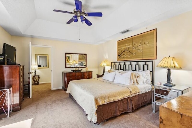 7 Atrium Cir Unit D, Atlantis, FL 33462 - carpeted bedroom with a raised ceiling and a ceiling fan