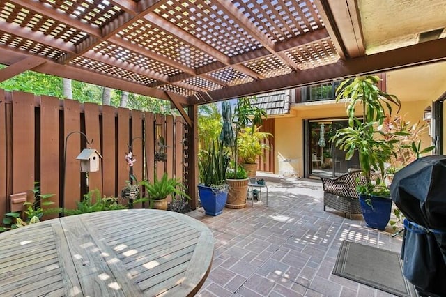 7 Atrium Cir Unit D, Atlantis, FL 33462 - view of patio with a pergola and grilling area