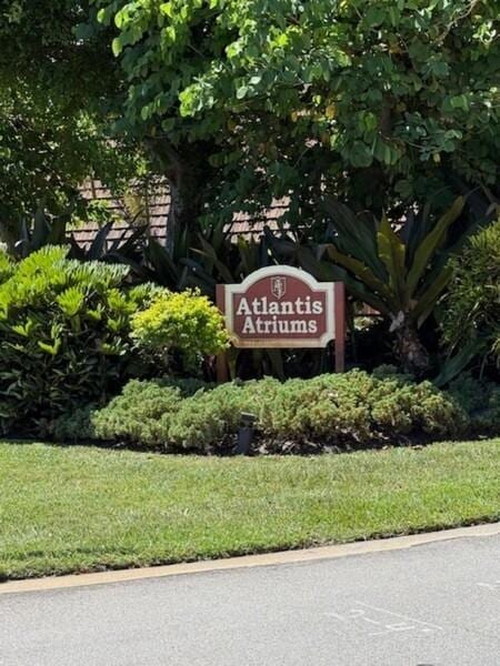 7 Atrium Cir Unit D, Atlantis, FL 33462 - community sign with a yard