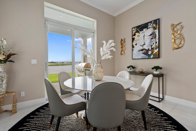 8650 SW Felicita Way, Port Saint Lucie, FL 34987 - dining space featuring light tile patterned flooring, a water view, and crown molding