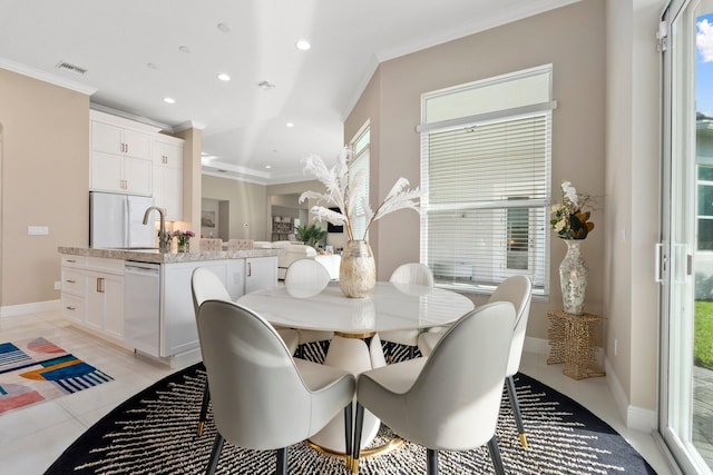 8650 SW Felicita Way, Port Saint Lucie, FL 34987 - dining area featuring ornamental molding, recessed lighting, and light tile patterned floors