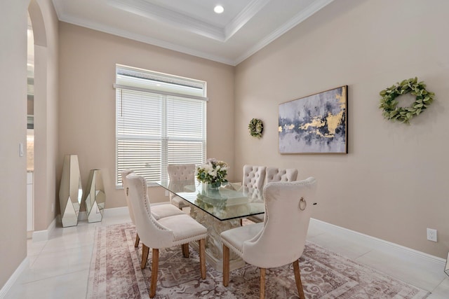 8650 SW Felicita Way, Port Saint Lucie, FL 34987 - dining room featuring ornamental molding, arched walkways, light tile patterned floors, a tray ceiling, and recessed lighting