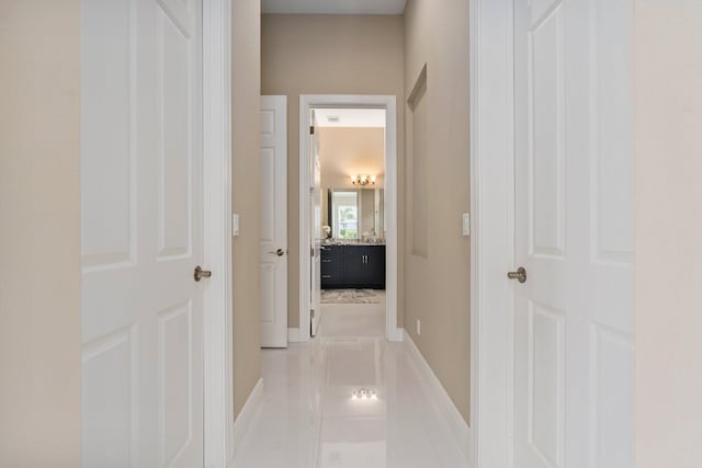 8650 SW Felicita Way, Port Saint Lucie, FL 34987 - hallway featuring baseboards and light tile patterned floors