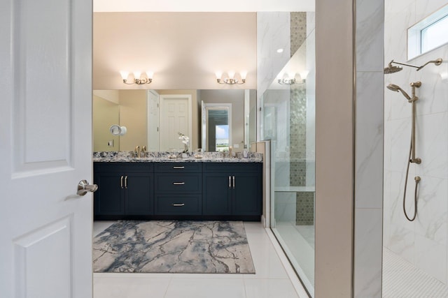 8650 SW Felicita Way, Port Saint Lucie, FL 34987 - full bathroom featuring a tile shower, double vanity, and tile patterned flooring