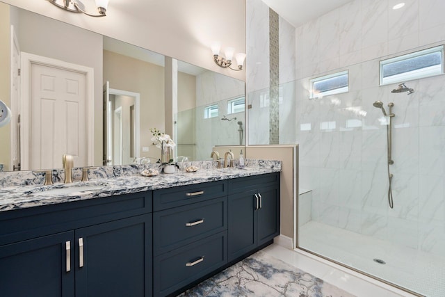 8650 SW Felicita Way, Port Saint Lucie, FL 34987 - full bathroom featuring double vanity, a walk in shower, and marble finish flooring