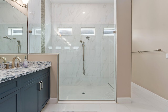 8650 SW Felicita Way, Port Saint Lucie, FL 34987 - bathroom with vanity, a walk in shower, and tile patterned floors