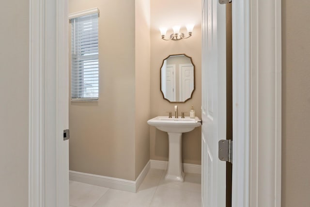 8650 SW Felicita Way, Port Saint Lucie, FL 34987 - bathroom featuring tile patterned flooring and baseboards