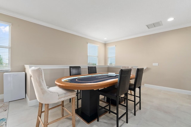 8650 SW Felicita Way, Port Saint Lucie, FL 34987 - dining area featuring healthy amount of natural light, crown molding, and recessed lighting
