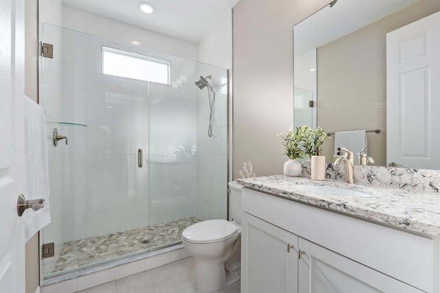 8650 SW Felicita Way, Port Saint Lucie, FL 34987 - full bathroom featuring vanity, a shower stall, and tile patterned flooring
