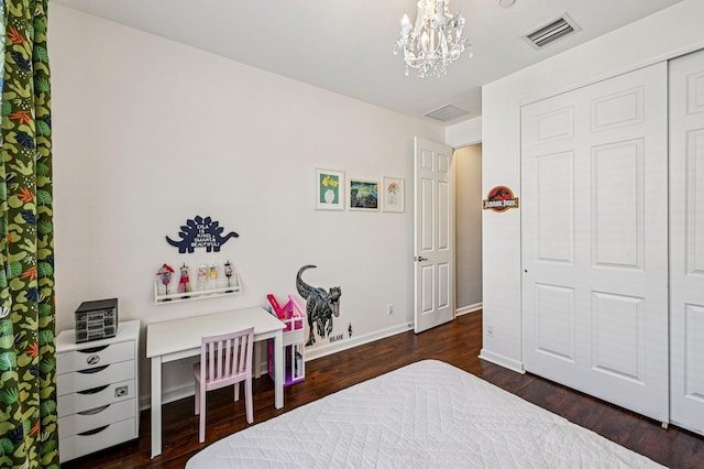 9425 SW Purple Martin Way, Stuart, FL 34997 - bedroom featuring a chandelier, dark wood-type flooring, and a closet