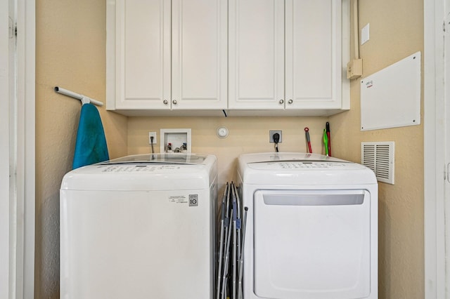 9425 SW Purple Martin Way, Stuart, FL 34997 - laundry room featuring washer and dryer and a textured wall