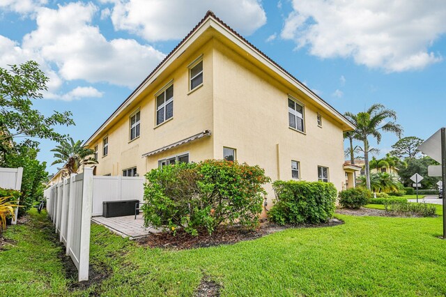9425 SW Purple Martin Way, Stuart, FL 34997 - view of side of property featuring stucco siding and a patio area