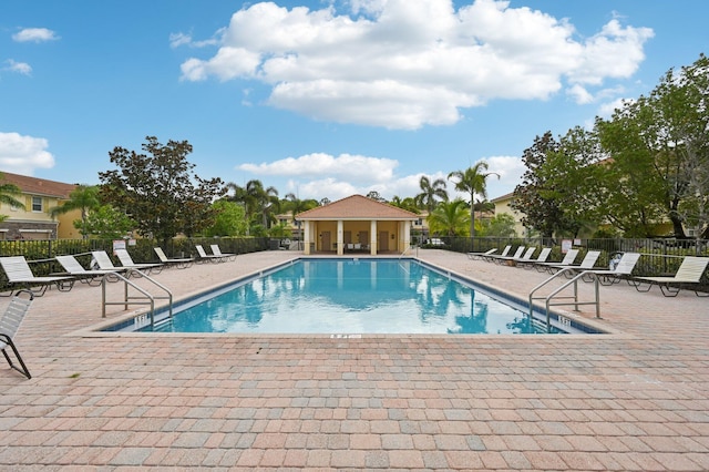 9425 SW Purple Martin Way, Stuart, FL 34997 - community pool with a patio area