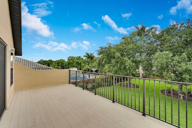 5857 NW Leghorn Ave, Port Saint Lucie, FL 34986 - wooden terrace with a lawn and view of scattered trees