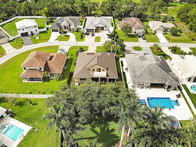 5857 NW Leghorn Ave, Port Saint Lucie, FL 34986 - aerial perspective of suburban area featuring a pool area