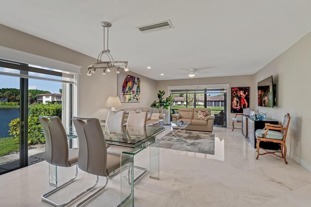 21290 Juego Cir Unit 12F, Boca Raton, FL 33433 - dining area featuring healthy amount of natural light, ceiling fan, light marble finish flooring, and recessed lighting