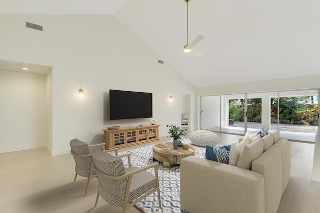 1365 Wilderness Rd, West Palm Beach, FL 33409 - living room featuring high vaulted ceiling, plenty of natural light, and light wood-style floors