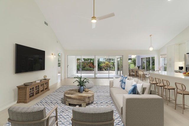 1365 Wilderness Rd, West Palm Beach, FL 33409 - living room with high vaulted ceiling and a ceiling fan