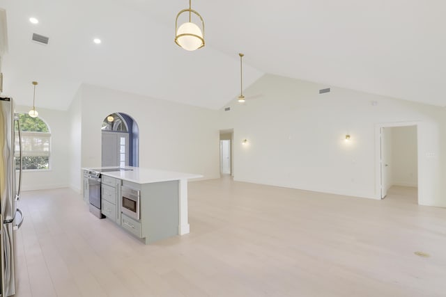 1365 Wilderness Rd, West Palm Beach, FL 33409 - empty room with light wood-style flooring, a ceiling fan, high vaulted ceiling, and recessed lighting