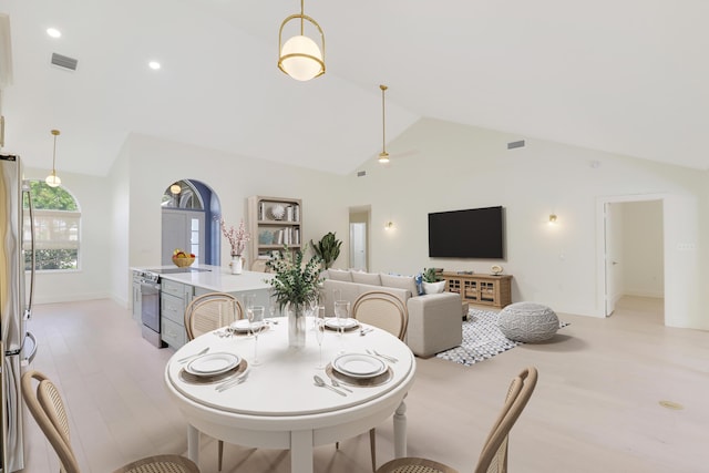 1365 Wilderness Rd, West Palm Beach, FL 33409 - dining space with high vaulted ceiling, ceiling fan, and light wood-style flooring