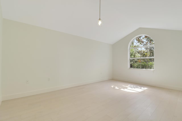 1365 Wilderness Rd, West Palm Beach, FL 33409 - unfurnished room with light wood-type flooring and vaulted ceiling
